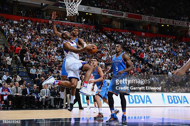 Arnett Moultrie of the Philadelphia 76ers shoots against the Oklahoma City Thunder at the Phones 4u Arena during the NBA Global Games on October 8,...
