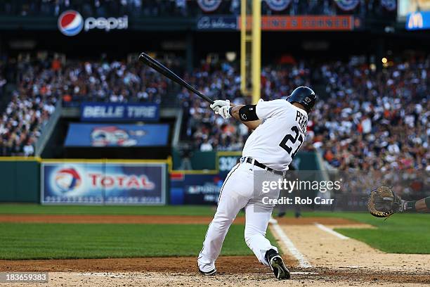 Jhonny Peralta of the Detroit Tigers hits a three run home run in the fifth inning against the Oakland Athletics during Game Four of the American...