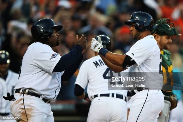 Jhonny Peralta of the Detroit Tigers celebrates his three run home run in the fifth inning with Prince Fielder during Game Four of the American...