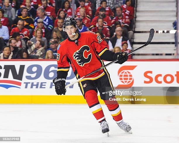 Sean Monahan of the Calgary Flames skates against the Vancouver Canucks during the Flames' home opening NHL game at Scotiabank Saddledome on October...