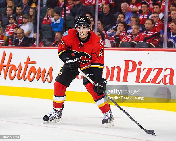 Sean Monahan of the Calgary Flames skates against the Vancouver Canucks during the Flames' home opening NHL game at Scotiabank Saddledome on October...