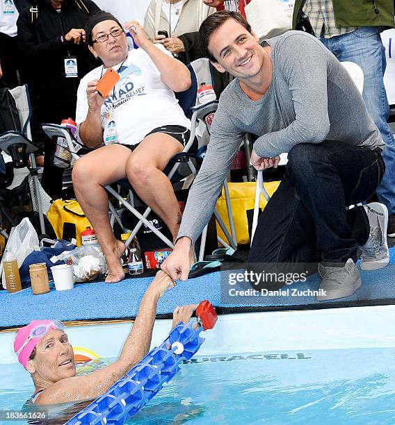 Diana Nyad and Olympic swimmer Ryan Lochte prepare to swim during the "Swim for Relief" benefiting Hurricane Sandy Recovery at Herald Square on...