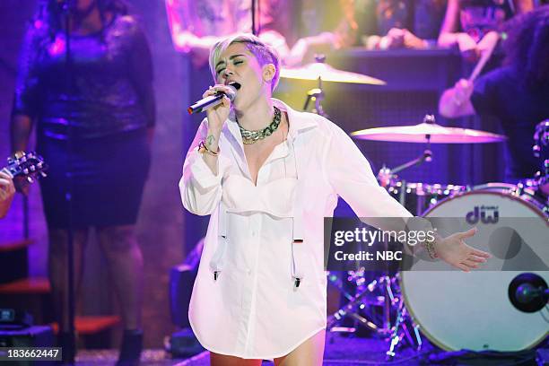 Episode 907 -- Pictured: Music guest Miley Cyrus performs "Wrecking Ball" on Tuesday, October 8, 2013--