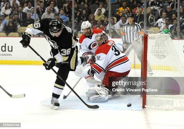 Jussi Jokinen of the Pittsburgh Penguins beats Cam Ward of the Carolina Hurricanes to give the Penguins a 1-0 lead during the first period on October...