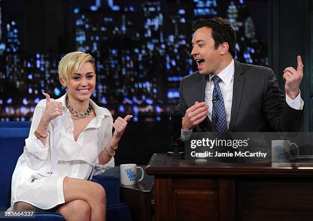 Miley Cyrus and host Jimmy Fallon visit "Late Night With Jimmy Fallon" at Rockefeller Center on October 8, 2013 in New York City.