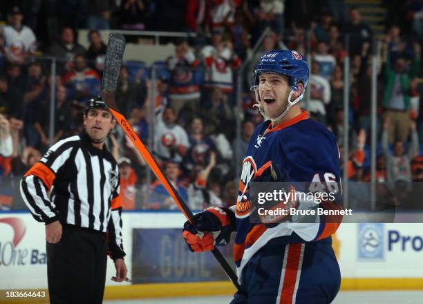 Matt Donovan of the New York Islanders celebrates his first NHL goal on the power play against the Phoenix Coyotes at 11:47 of the second period at...