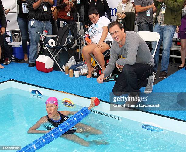 Ryan Lochte and Diana Nyad attend Swim for Relief benefiting Hurricane Sandy recovery at Herald Square on October 8, 2013 in New York City.