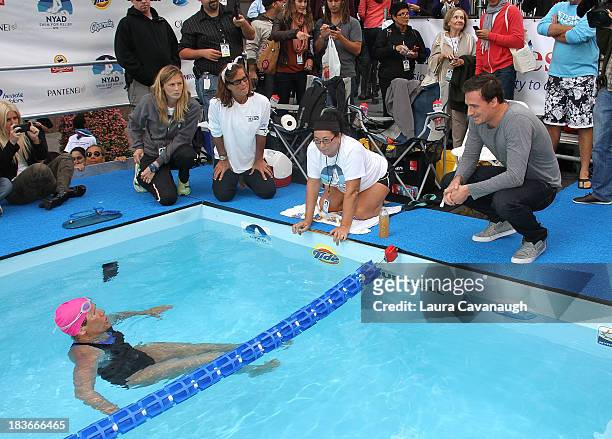 Ryan Lochte and Diana Nyad attend Swim for Relief benefiting Hurricane Sandy recovery at Herald Square on October 8, 2013 in New York City.