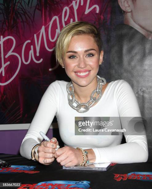 Miley Cyrus attends the Miley Cyrus "Bangerz" Record Release Signing at Planet Hollywood Times Square on October 8, 2013 in New York City.