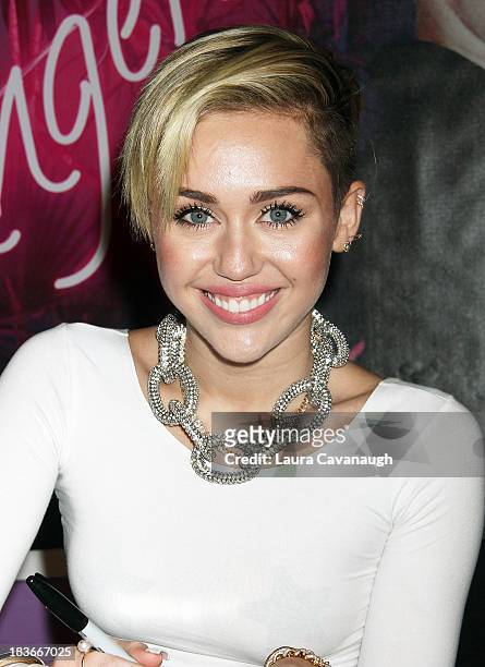 Miley Cyrus attends the Miley Cyrus "Bangerz" Record Release Signing at Planet Hollywood Times Square on October 8, 2013 in New York City.