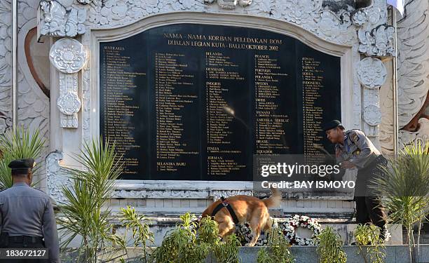 Indonesian K-9 police searches prior to the visit of Prime Minister Tony Abbott at Bali bombing monument in Kuta, on October 9 before he leaves for...