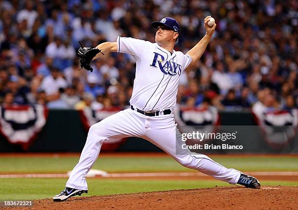 Jake McGee of the Tampa Bay Rays pitches against the Boston Red Sox in the seventh inning during Game Four of the American League Division Series at...