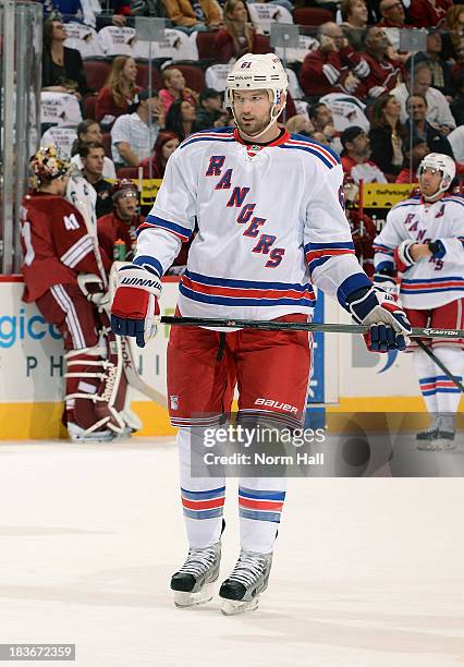 Rick Nash of the New York Rangers skates up ice against the Phoenix Coyotes at Jobing.com Arena on October 3, 2013 in Glendale, Arizona.