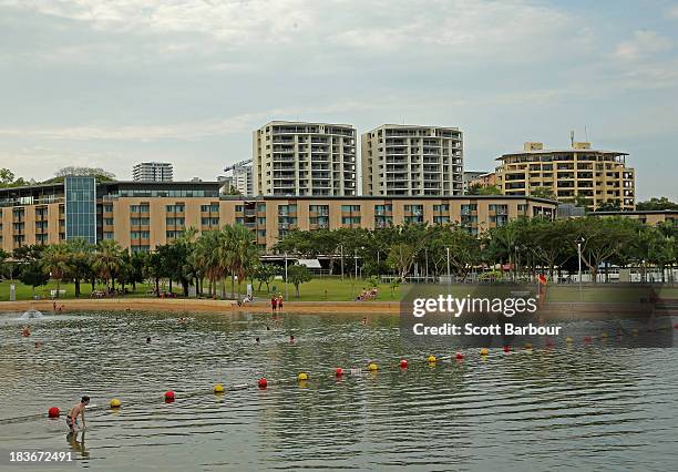 People swim in the Darwin Waterfront Recreation Lagoon on October 6, 2013 in Darwin, Australia. Darwin is the capital of the Northern Territory and...