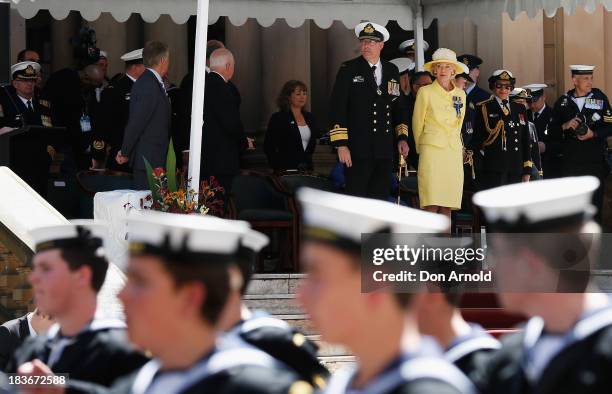 The Governor-General Quentin Bryce observes Navy personnel from the Town Hall steps as they march down George St on October 9, 2013 in Sydney,...