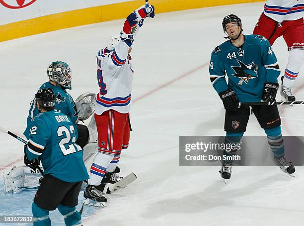 Marc-Edouard Vlasic, Dan Boyle and Antti Niemi of the San Jose Sharks react as Ryan Callahan of the New York Rangers celebrates a goal during an NHL...