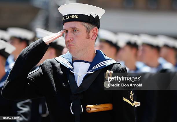 Navy personnel salute the Governor-General as they march down George Street on October 9, 2013 in Sydney, Australia. Over 4,000 personnel paraded...