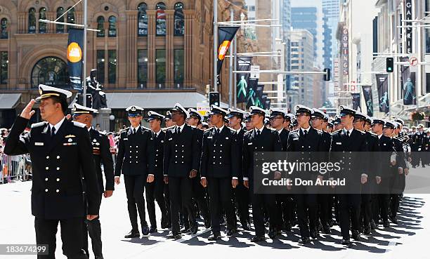 Navy personnel from RSS Endeavour salute the Governor-General as they march down George Street on October 9, 2013 in Sydney, Australia. Over 4,000...