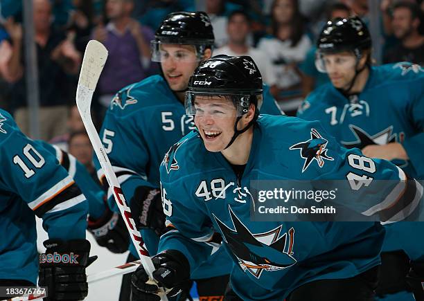 Tomas Hertl, Jason Demers and Brad Stuart of the San Jose Sharks celebrate Hertl's goal against the New York Rangers during an NHL game on October 8,...