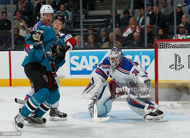 Tomas Hertl of the San Jose Sharks creates traffic in front of the net against Anton Stralman and Henrik Lundqvist of the New York Rangers during an...