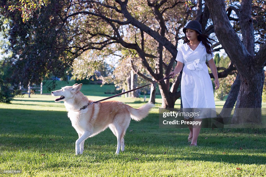 Teenage girl walking the dog