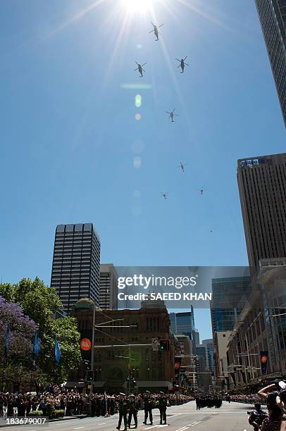 Sailors march past the Sydney Town Hall during a combined navies parade on George Street in the central business district of Sydney on October 9,...