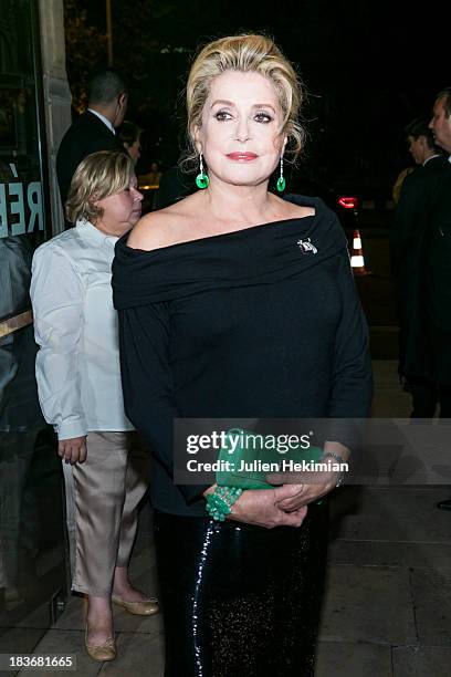 Catherine Deneuve poses after arriving at Les Beaux-Arts de Paris on October 8, 2013 in Paris, France. On this occasion Ralph Lauren celebrates the...