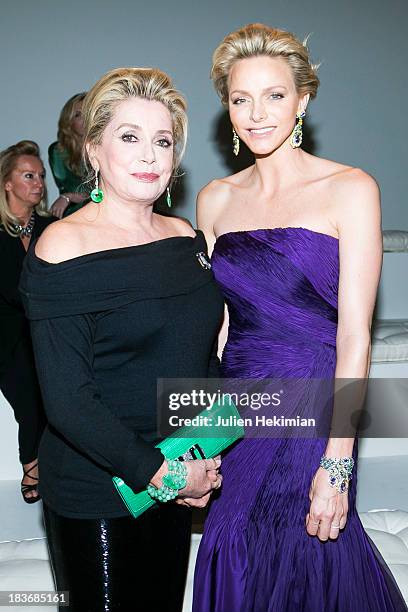 Catherine Deneuve and Princess Charlene of Monaco attend the presentation of the Ralph Lauren Fall 13 Collection Show at Les Beaux-Arts de Paris on...