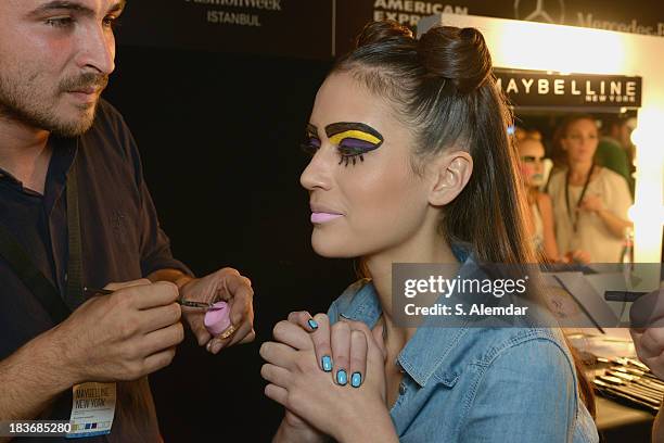 Model is seen backstage at the Maybelline New York By DB Berdan show during Mercedes-Benz Fashion Week Istanbul s/s 2014 presented by American...