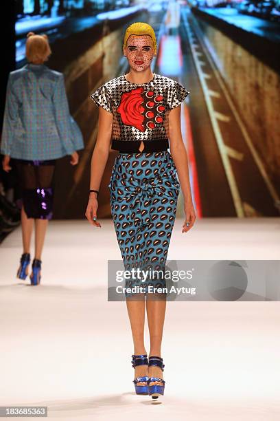 Model walks the runway at the Maybelline New York By DB Berdan show during Mercedes-Benz Fashion Week Istanbul s/s 2014 presented by American Express...