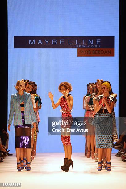 Fashion designer Deniz Berdan walks the runway at the Maybelline New York By DB Berdan show during Mercedes-Benz Fashion Week Istanbul s/s 2014...