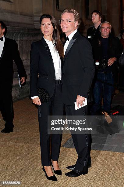 Olivier Royant and his wife Delphine arrive to the Ralph Lauren Collection Show and private dinner at Les Beaux-Arts de Paris on October 8, 2013 in...