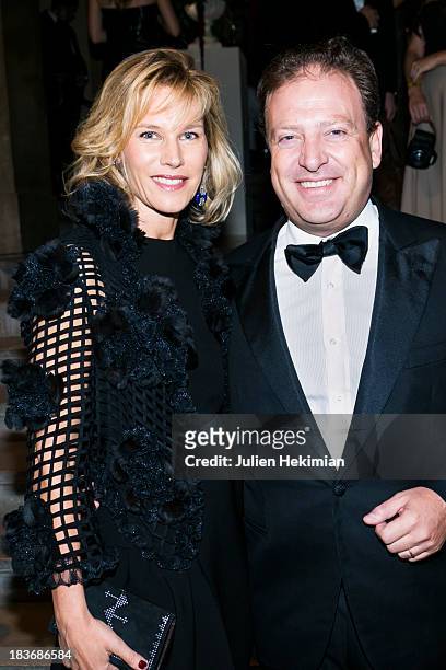 Maurizio Borletti and his wife pose after arriving at Les Beaux-Arts de Paris on October 8, 2013 in Paris, France. On this occasion Ralph Lauren...