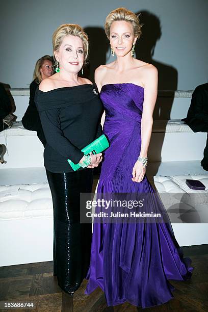 Catherine Deneuve and Princess Charlene of Monaco attend the presentation of the Ralph Lauren Fall 13 Collection Show at Les Beaux-Arts de Paris on...