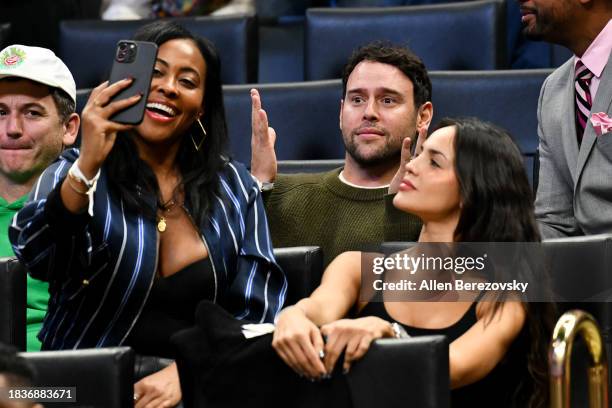 Nichelle Hines takes a selfie with Scooter Braun and Eiza Gonzalez during a basketball game between the Los Angeles Clippers and the Denver Nuggets...