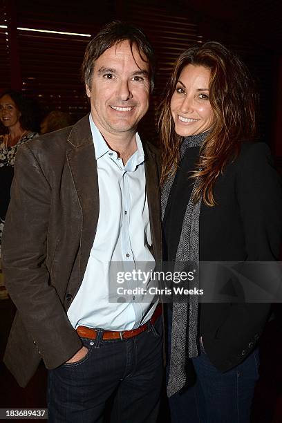 Director Greg Camalier and actress Gina Gershon attend a special screening of "Muscle Shoals" at the Landmark Theater on October 8, 2013 in Los...
