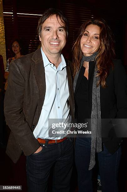 Director Greg Camalier and actress Gina Gershon attends a special screening of "Muscle Shoals" at the Landmark Theater on October 8, 2013 in Los...
