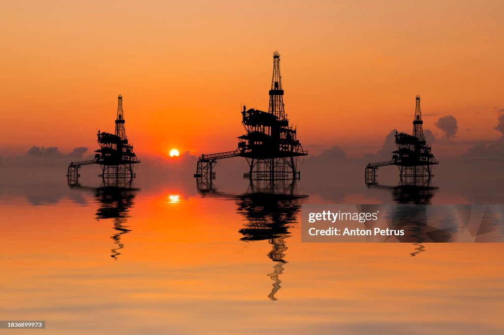 Offshore oil rigs at sunset. World Oil Industry