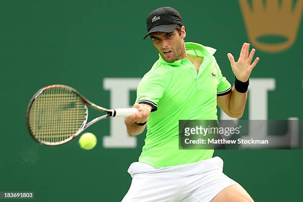 Pablo Andujar of Spain returns a shot to Jo-Wilfried Tsonga of France during the Shanghai Rolex Masters at the Qi Zhong Tennis Center on October 9,...