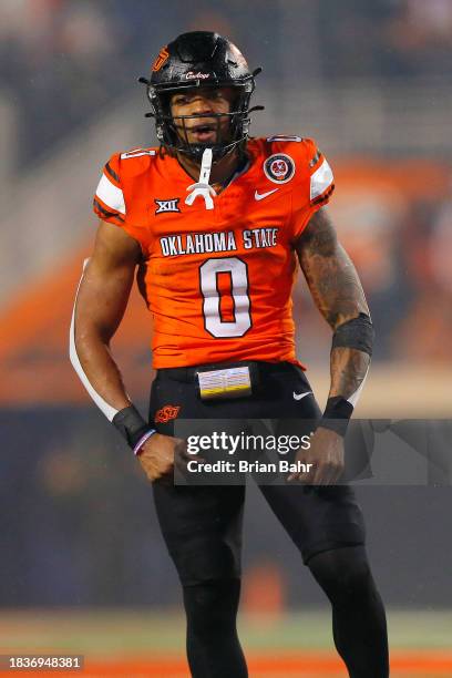 Running back Ollie Gordon II of the Oklahoma State Cowboys celebrates after scoring on a two-yard touchdown run against the BYU Cougars in the fourth...