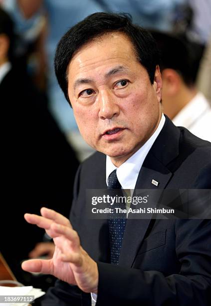 Mizuho Bank President Yasuhiro Sato speaks on his bank's latest scandal involving loans to members of crime syndicates at a news conference at Bank...