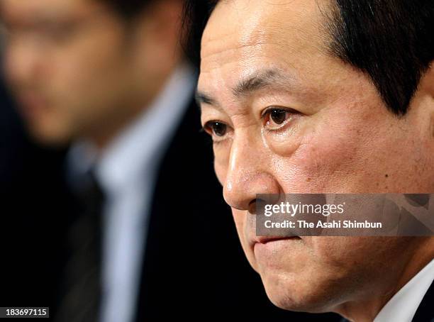 Mizuho Bank President Yasuhiro Sato speaks on his bank's latest scandal involving loans to members of crime syndicates at a news conference at Bank...