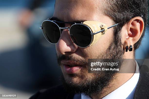 Cenk Tasdemir wears Spitfire glasses during Mercedes-Benz Fashion Week Istanbul s/s 2014 presented by American Express on October 9, 2013 in...