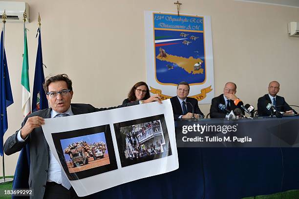 Rosario Crocetta, President of Sicily, holds a banner showing immigrants as Cecilia Malmstrom, European Commisssioner, Manuel Barroso, President of...