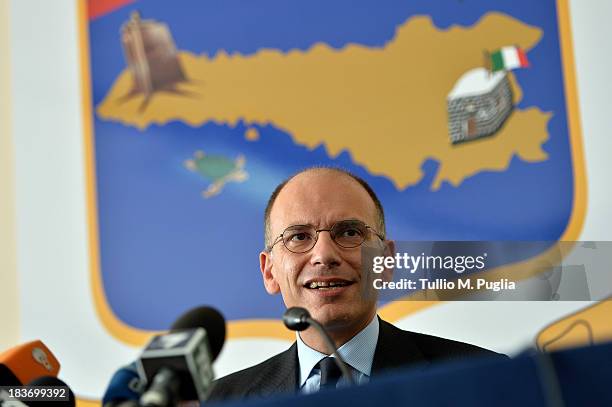 Enrico Letta, the Italian Prime Minister attends a press conference at Aeronautica Militare head quarter at Lampedusa airport on October 9, 2013 in...