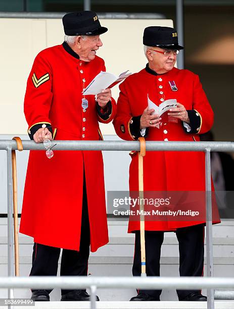 Two Chelsea Pensioners study their race cards as they attend the CAMRA Beer Festival Race Day at Ascot Racecourse on October 5, 2013 in London,...