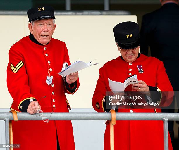 Two Chelsea Pensioners study their race cards as they attend the CAMRA Beer Festival Race Day at Ascot Racecourse on October 5, 2013 in London,...