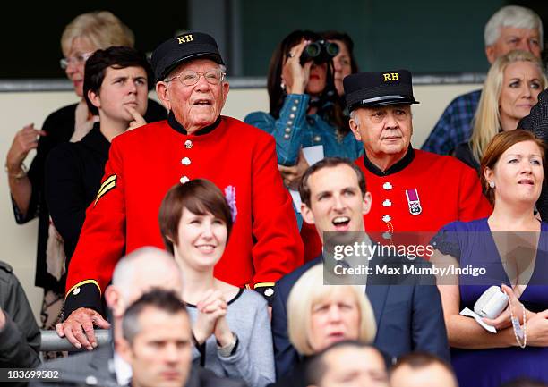 Two Chelsea Pensioners watch the racing as they attend the CAMRA Beer Festival Race Day at Ascot Racecourse on October 5, 2013 in London, England.