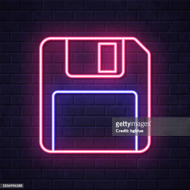 diskette. leuchtende neon-ikone auf backsteinwandhintergrund - magnetwand stock-grafiken, -clipart, -cartoons und -symbole