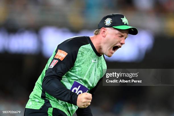 Tom Rogers of the Stars celebrates catching out Usman Khawaja of the Heat during the BBL match between Brisbane Heat and Melbourne Stars at The...